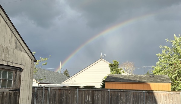 a photo of a rainbow behind my house taken on my birthday this year. I found myself feeling depressed that day.