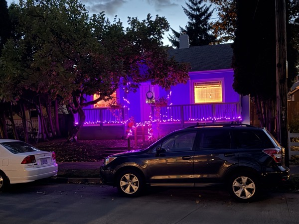 a home decorated for Halloween with fun exterior illumination